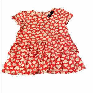 Red top with white hearts